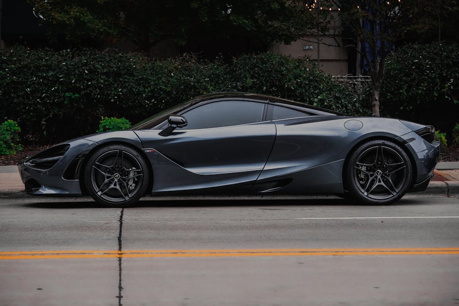 Elegant sports car with modern design parked on a city street, showcasing luxury and style.